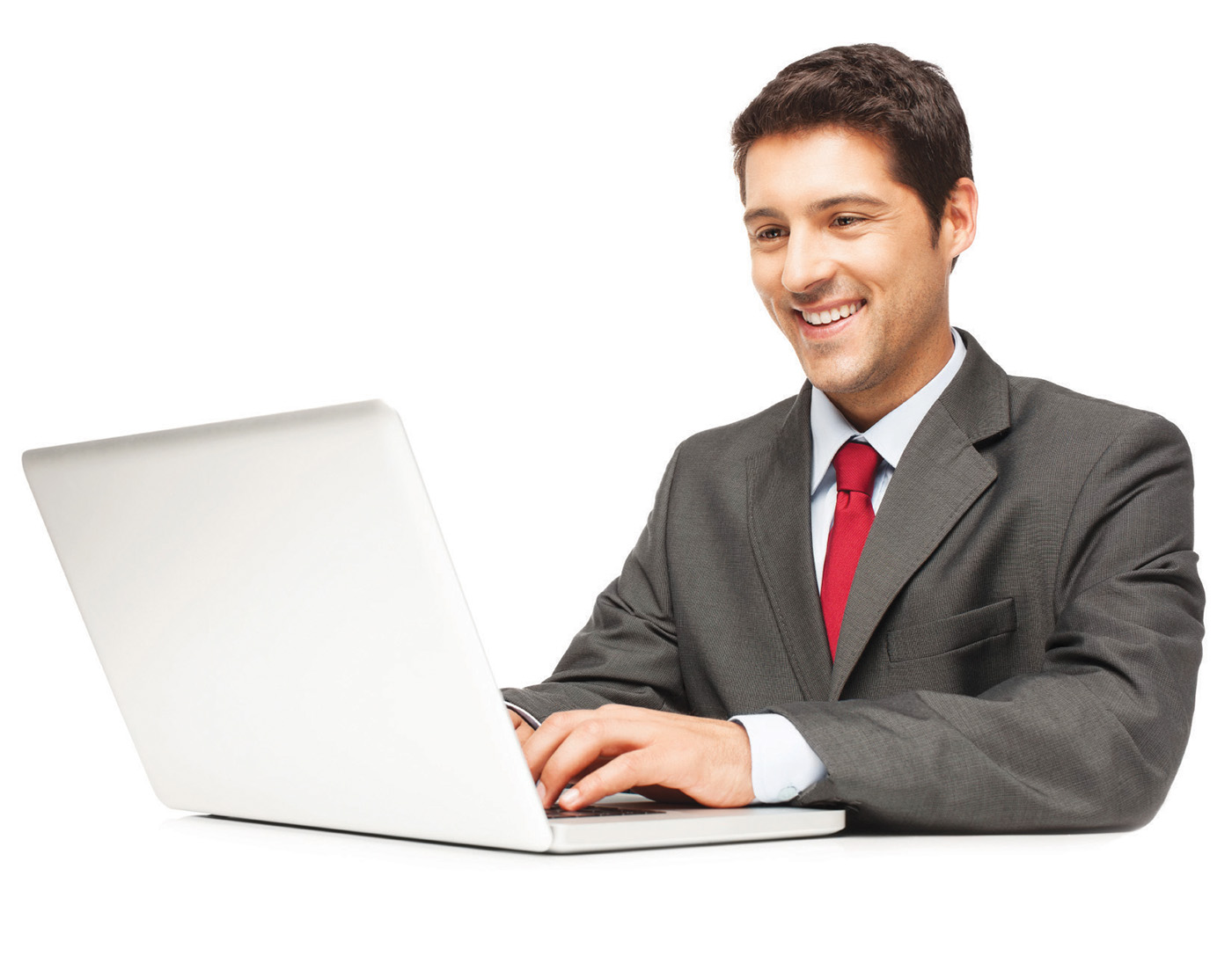 Happy businessman at desk working on laptop. Horizontal shot. Isolated on white.